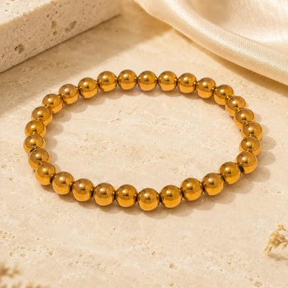 Bracelet extensible doré perlé en PVD Norelle™ pour femme