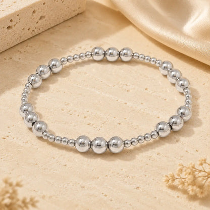 Bracelet extensible doré perlé en PVD Norelle™ pour femme