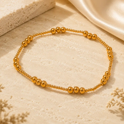 Bracelet extensible doré perlé en PVD Norelle™ pour femme