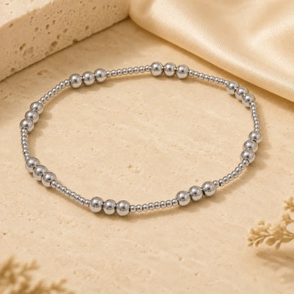 Bracelet extensible doré perlé en PVD Norelle™ pour femme