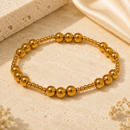Bracelet extensible doré perlé en PVD Norelle™ pour femme