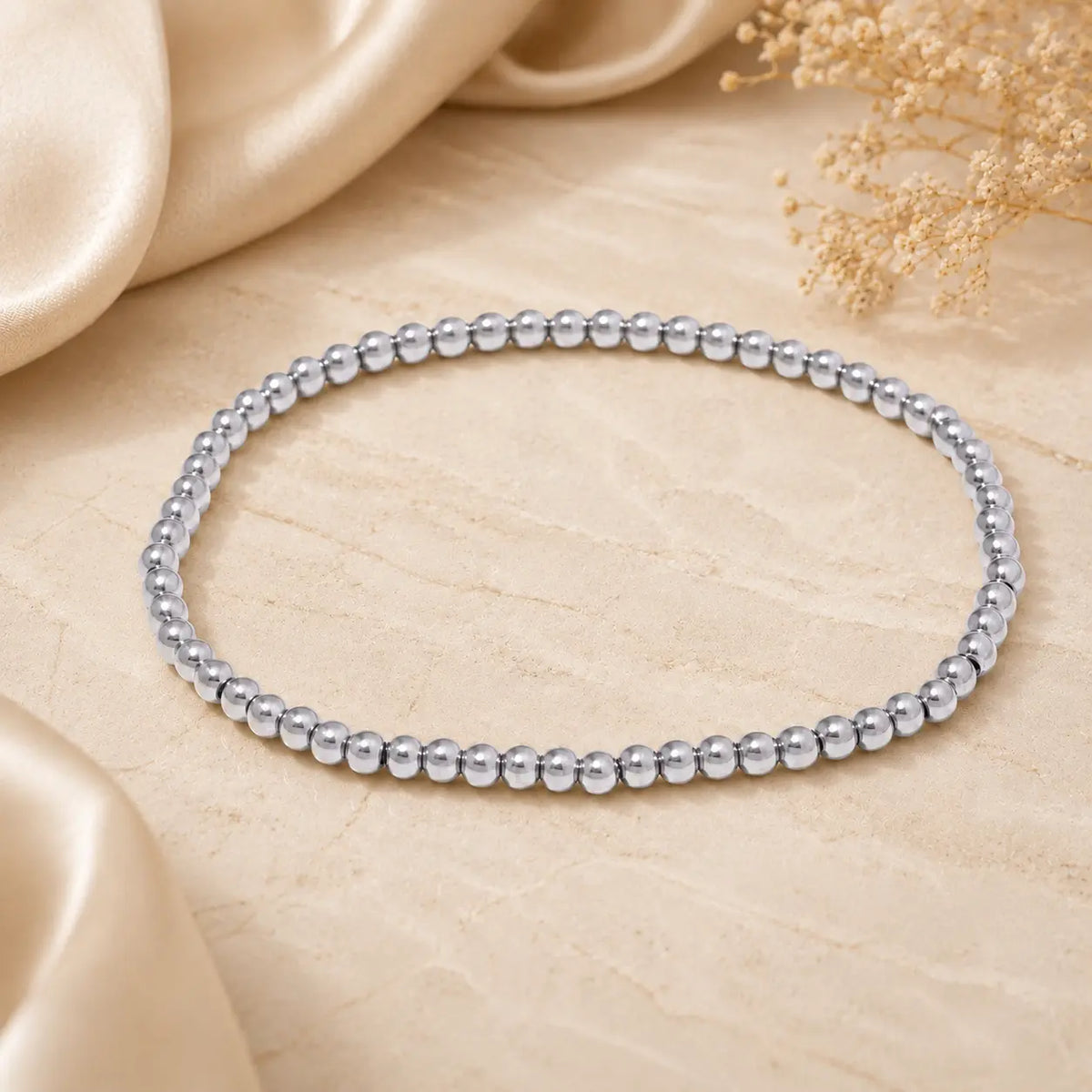 Bracelet extensible doré perlé en PVD Norelle™ pour femme