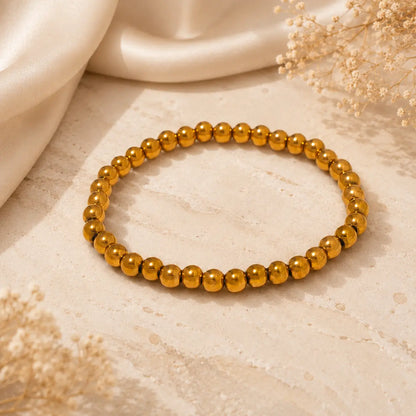 Bracelet extensible doré perlé en PVD Norelle™ pour femme