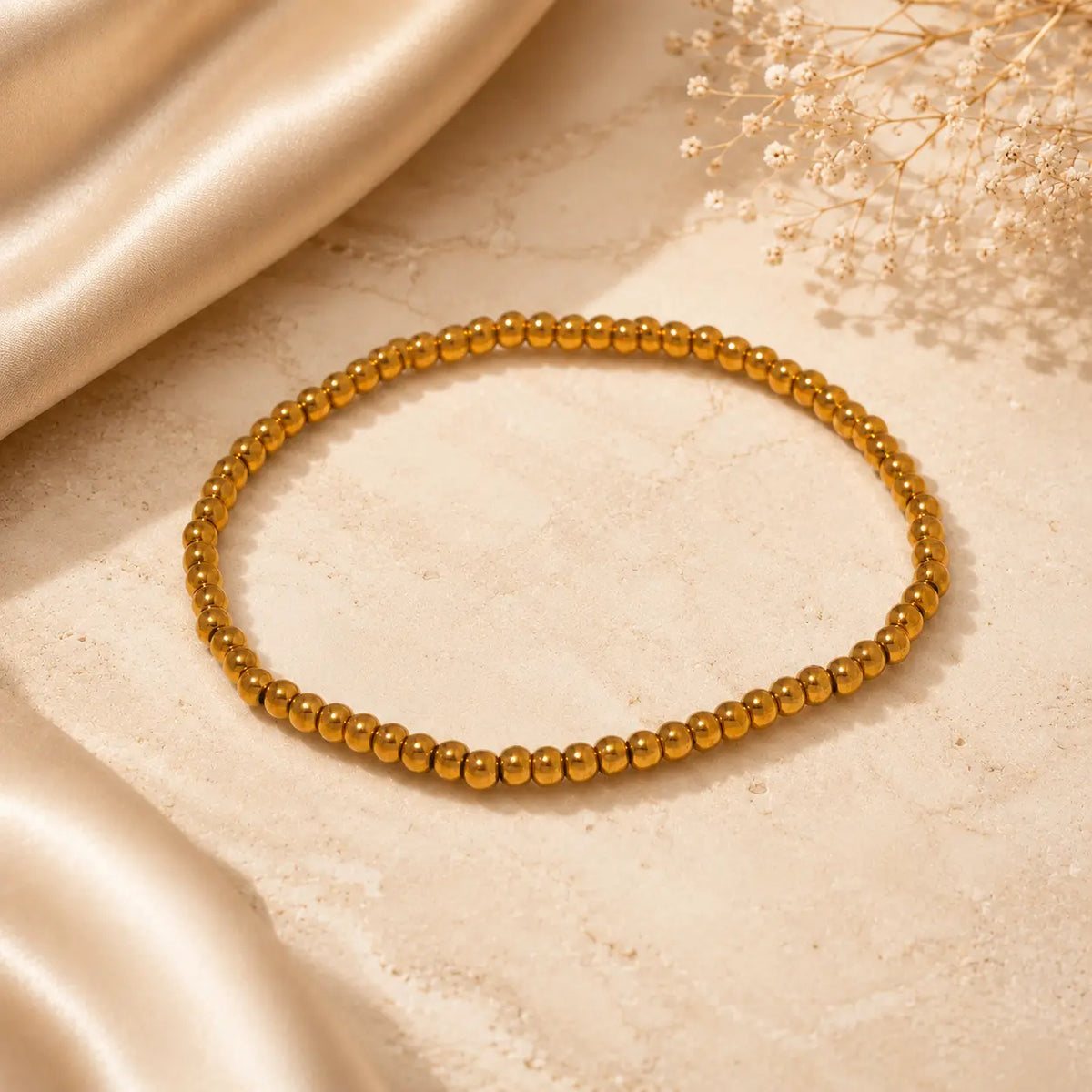 Bracelet extensible doré perlé en PVD Norelle™ pour femme