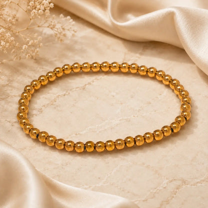 Bracelet extensible doré perlé en PVD Norelle™ pour femme