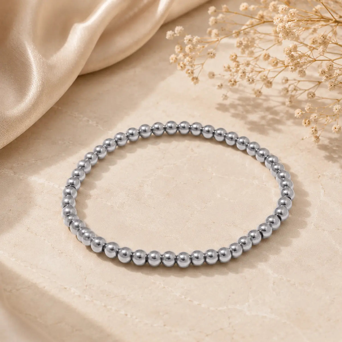 Bracelet extensible doré perlé en PVD Norelle™ pour femme