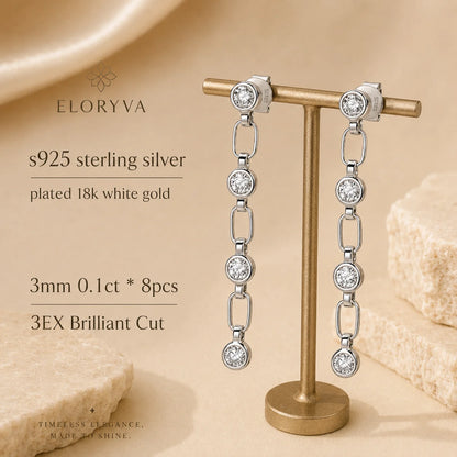 Liora 925 sterling silver linear drop earrings with white gold plating and eight 3 mm brilliant-cut stones.