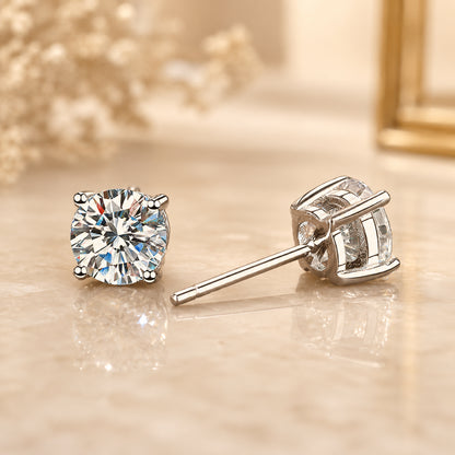 Moissanite stud earrings shown from front and side view with brilliant sparkle and elegant silver setting.