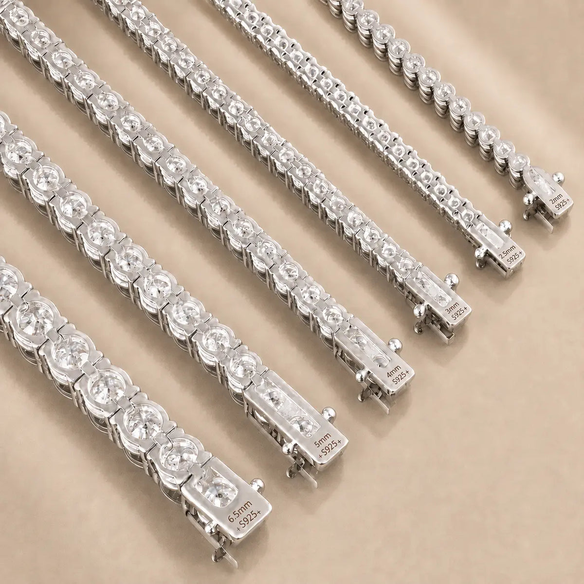 Close-up of Cirelle™ round moissanite tennis bracelets showing brilliant stones and secure silver-tone clasps.