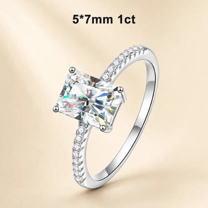 1 carat radiant-cut moissanite engagement ring with a 5 x 7 mm center stone and sparkling pavé band.