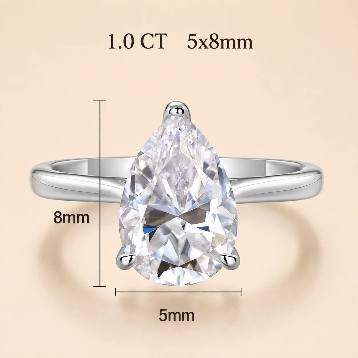 1 carat pear-cut moissanite engagement ring with a 5 x 8 mm center stone in a polished silver setting.