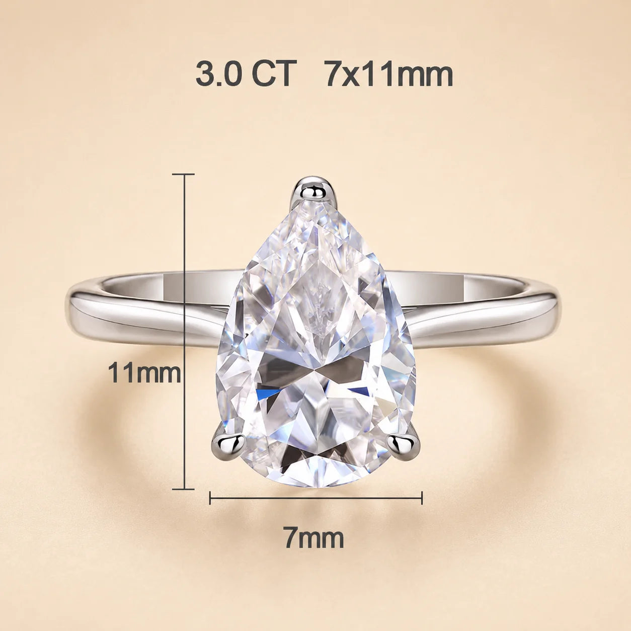 3 carat pear-cut moissanite engagement ring with a 7 x 11 mm center stone in a refined silver solitaire setting.