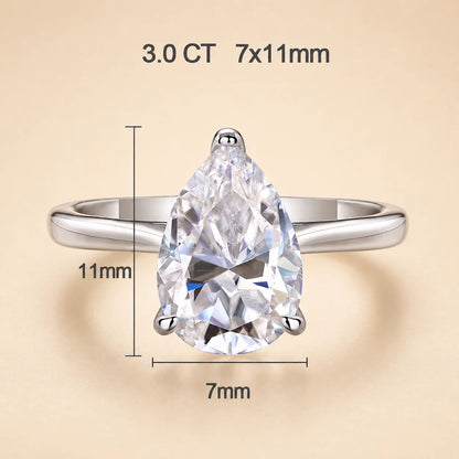 3 carat pear-cut moissanite engagement ring with a 7 x 11 mm center stone in a refined silver solitaire setting.