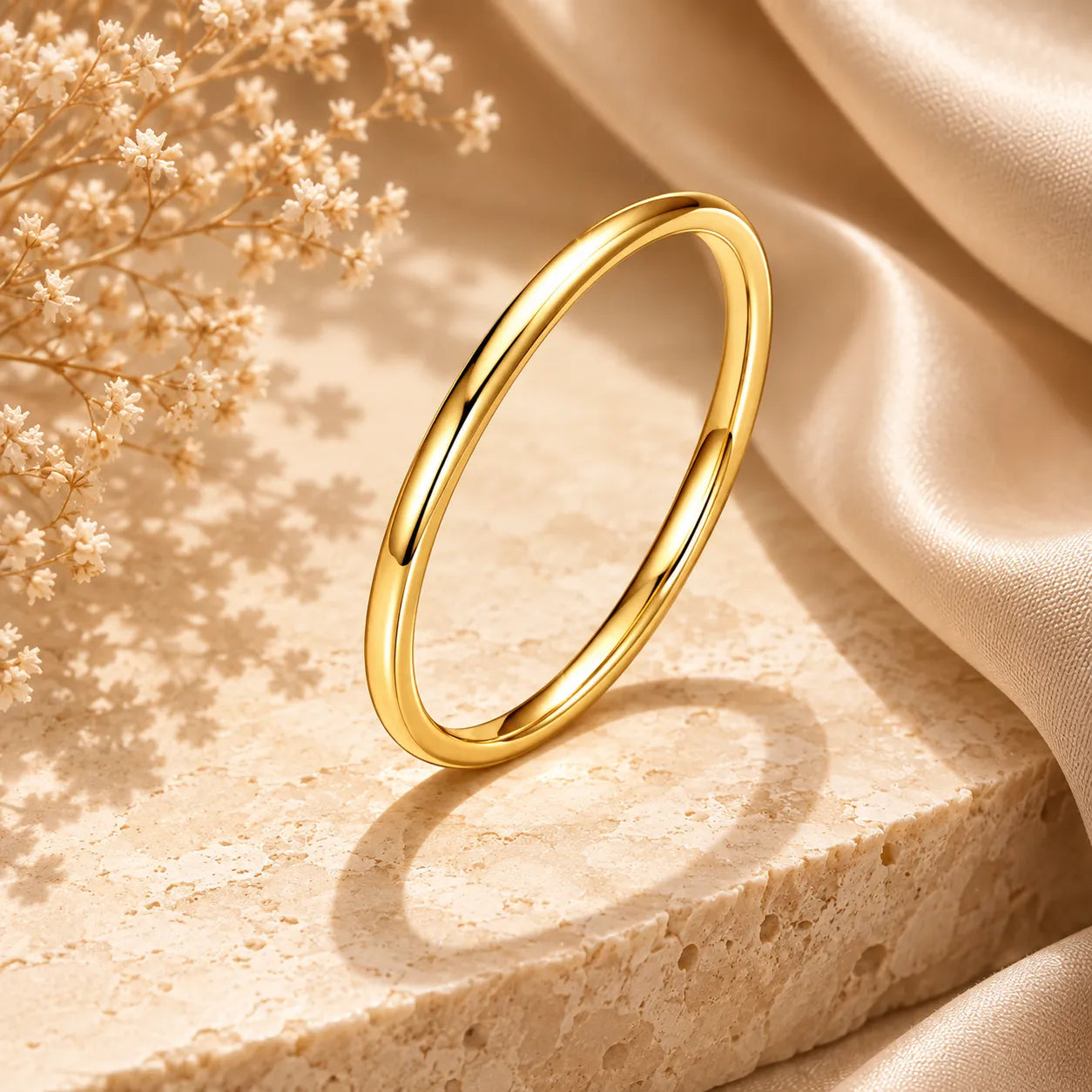 Minimal gold Bexley™ Moissanite Stacking Ring for Women displayed on a beige luxury surface.