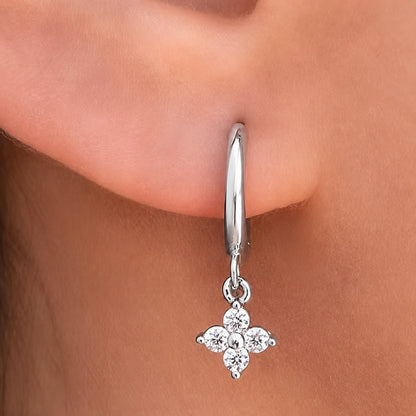 Close-up of a Clovera™ Clover Moissanite Hoop Drop Earring with a delicate clover-shaped moissanite pendant.