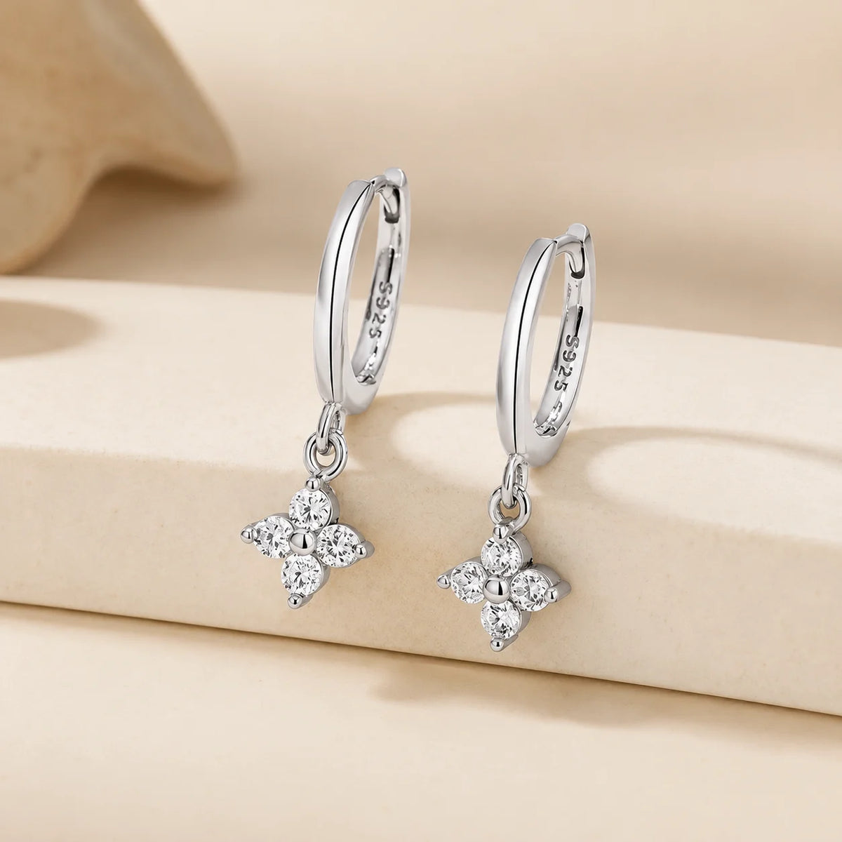Clovera™ Clover Moissanite Hoop Drop Earrings in sterling silver with sparkling clover-shaped moissanite drops.