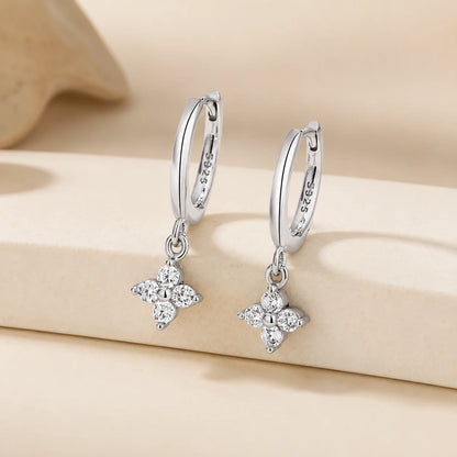 Clovera™ Clover Moissanite Hoop Drop Earrings in sterling silver with sparkling clover-shaped moissanite drops.