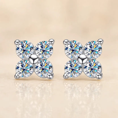 Front view of Elaris™ silver four-petal moissanite stud earrings featuring four brilliant round stones in a symmetrical floral design.