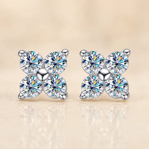 Front view of Elaris™ silver four-petal moissanite stud earrings featuring four brilliant round stones in a symmetrical floral design.