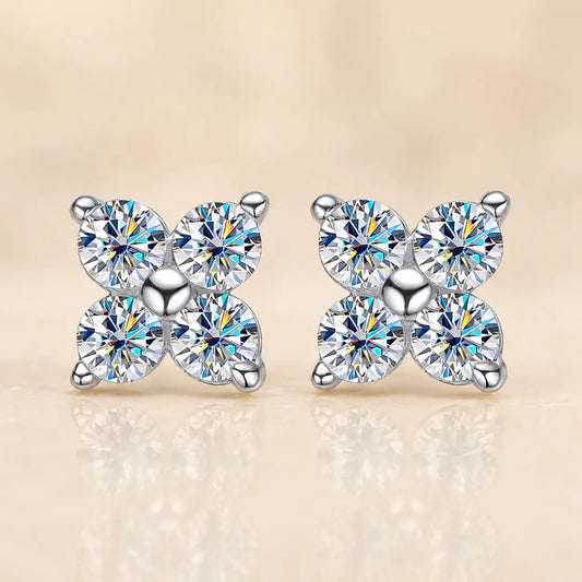 Front view of Elaris™ silver four-petal moissanite stud earrings featuring four brilliant round stones in a symmetrical floral design.