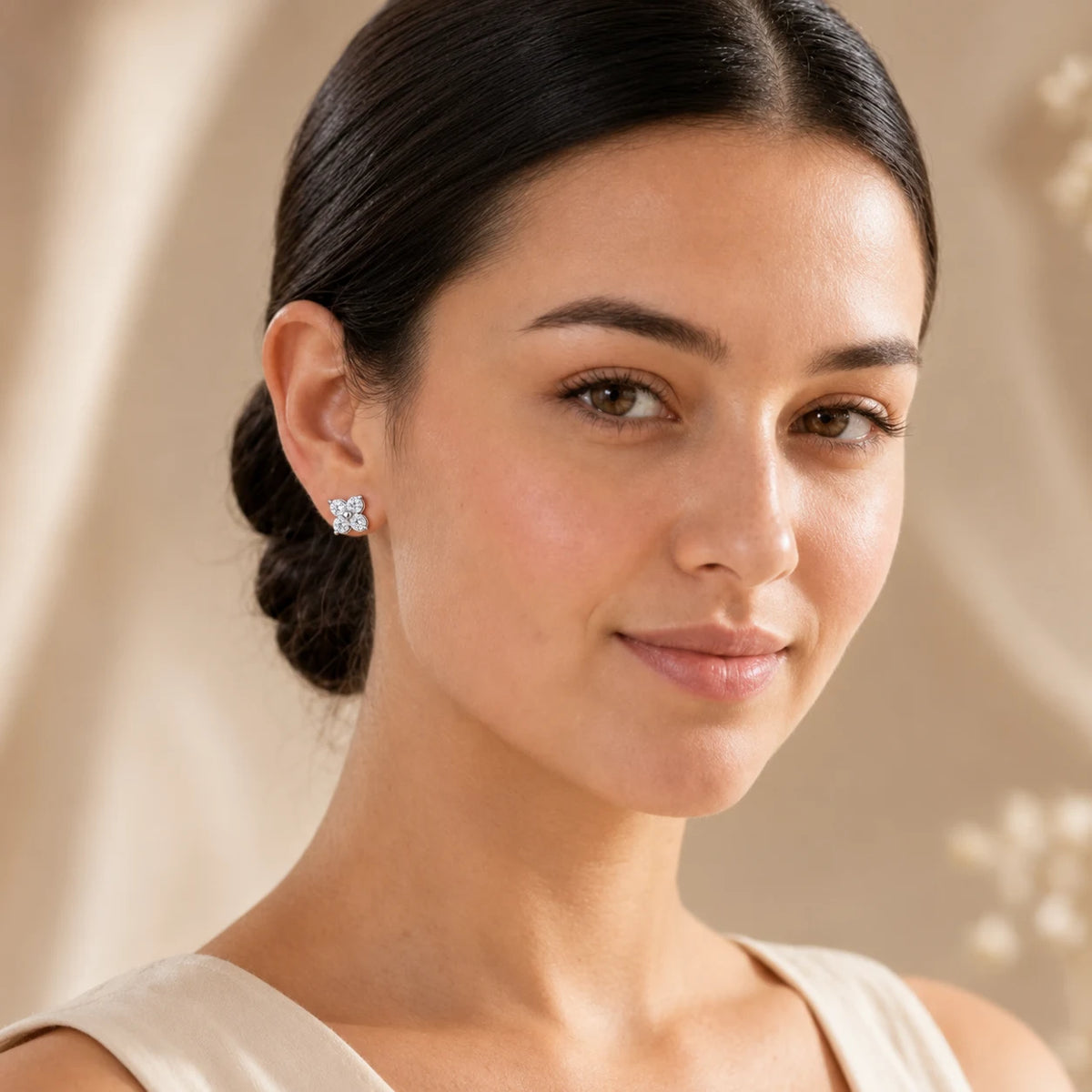 Woman wearing Elaris™ Four-Petal Moissanite Stud Earrings for an elegant everyday look.