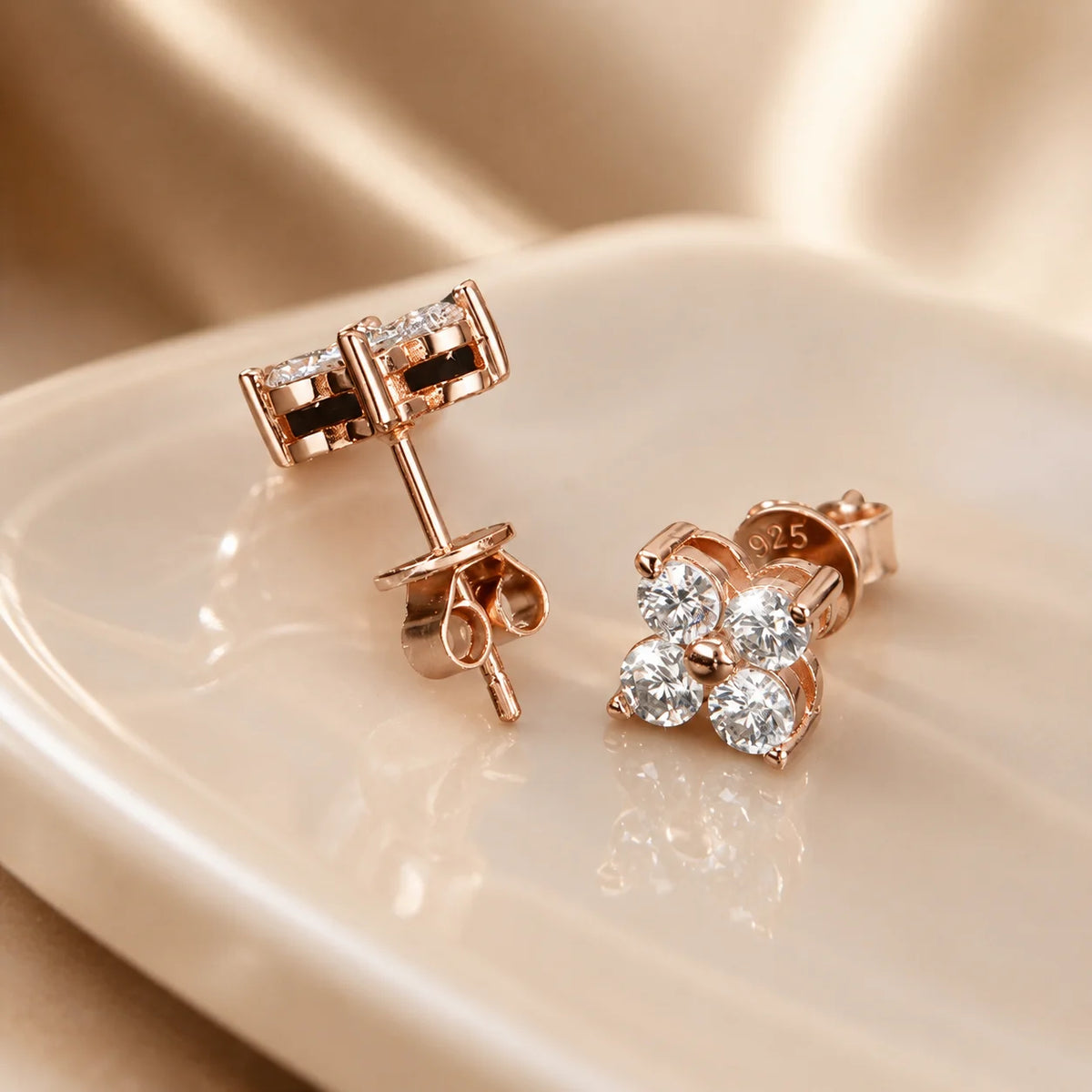 Front and back views of Elaris™ rose gold four-petal moissanite stud earrings showing the posts and butterfly backs.