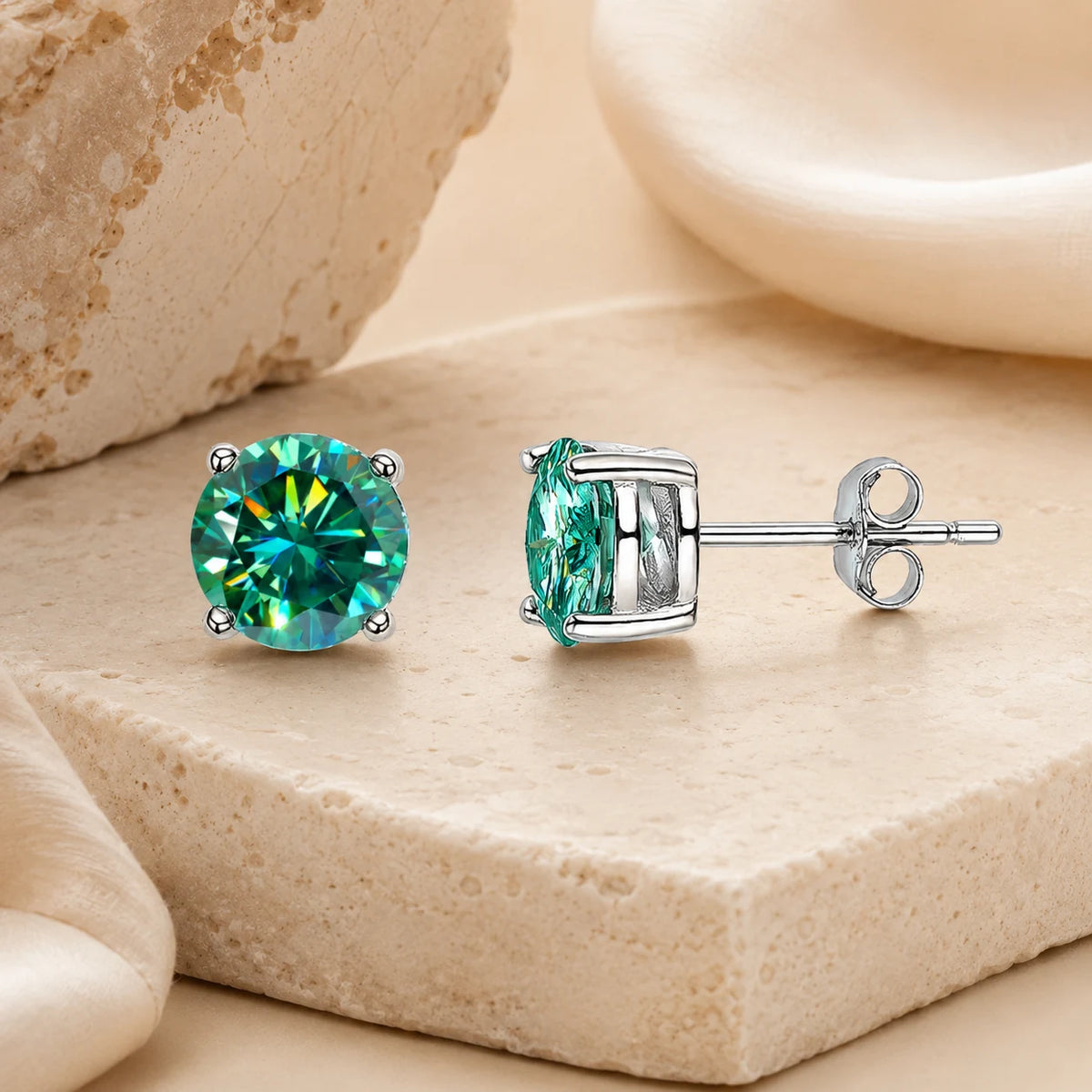Front and side views of Eloryva green round-cut gemstone stud earrings with silver-tone posts and butterfly backs.