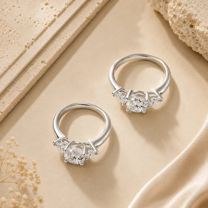 Two heart-cut moissanite engagement rings displayed together to compare different center-stone sizes.
