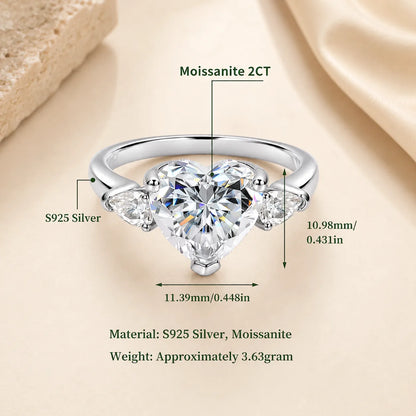 Two-carat heart-cut moissanite engagement ring in S925 sterling silver with side stones and product measurements.