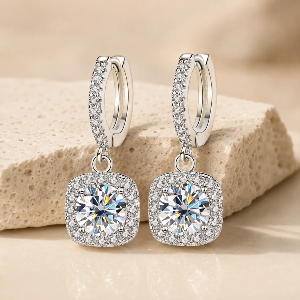 Back and side view of Marielle™ halo moissanite drop earrings showing the secure huggie clasps and stone settings.