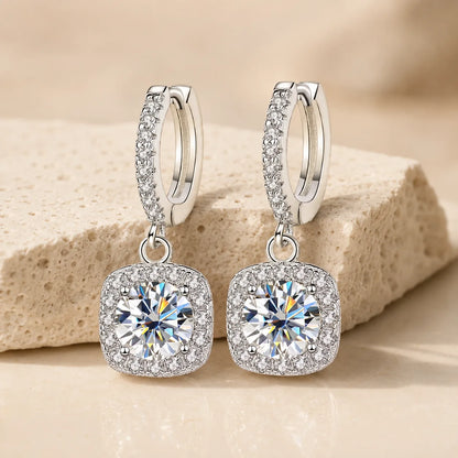 Back and side view of Marielle™ halo moissanite drop earrings showing the secure huggie clasps and stone settings.