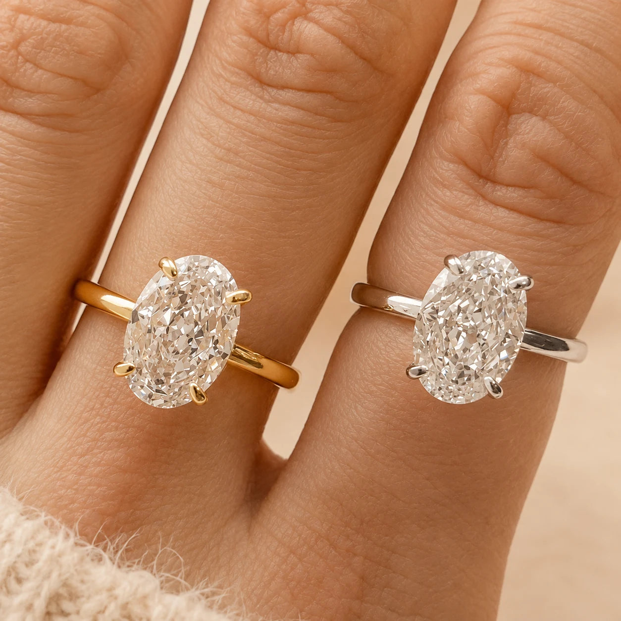 Marlowe™ Oval Moissanite Engagement Ring shown in yellow gold, rose gold and silver finishes on a woman’s hand.