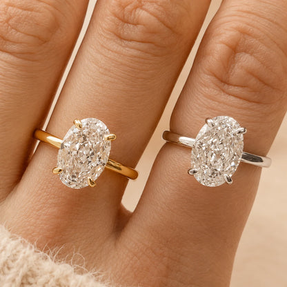 Marlowe™ Oval Moissanite Engagement Ring shown in yellow gold, rose gold and silver finishes on a woman’s hand.