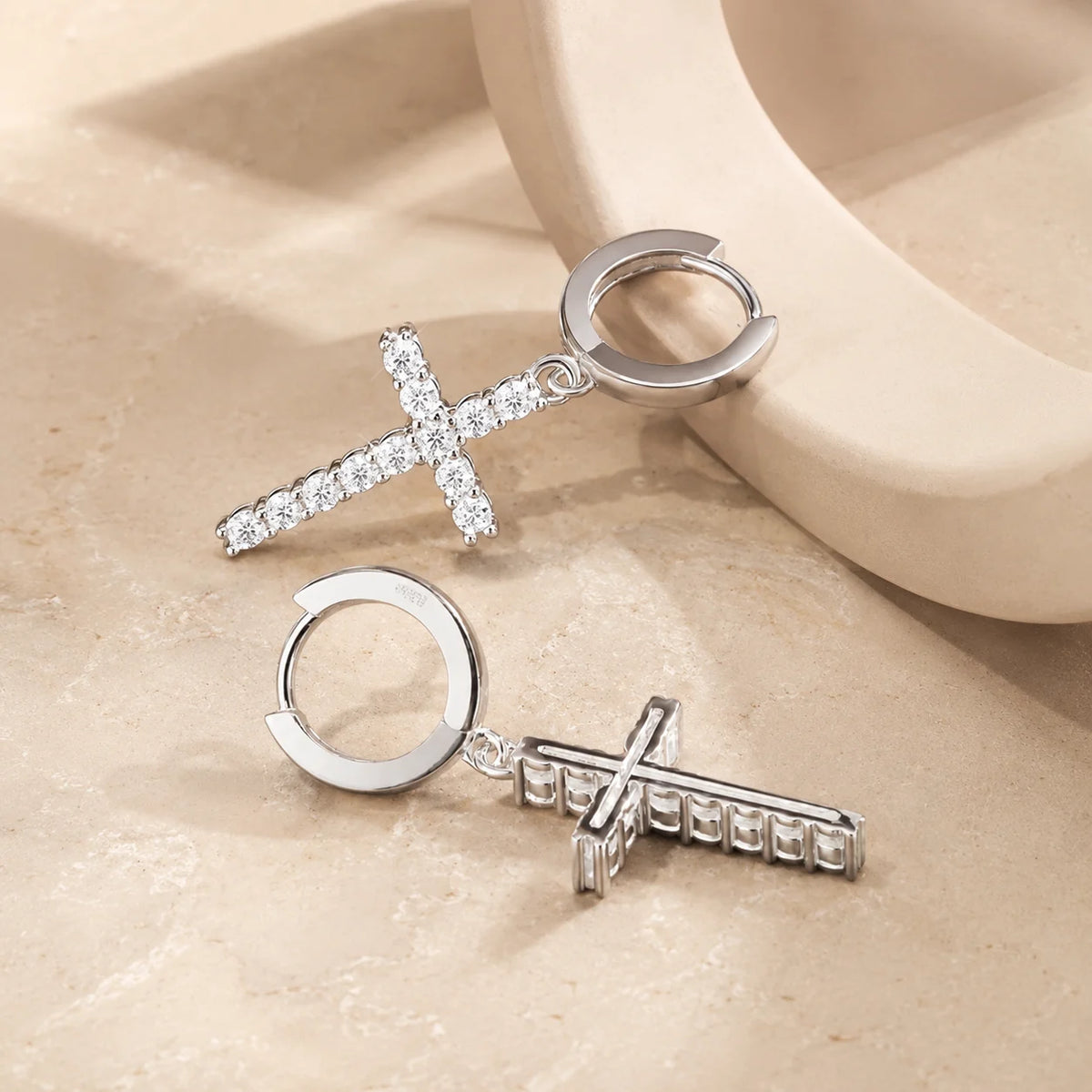 Back and side view of moissanite cross hoop earrings showing the hinged clasps and stone-set cross charms.