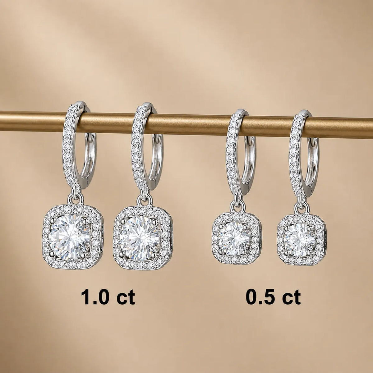 Marielle™ halo moissanite drop earrings displayed in 0.5 carat and 1.0 carat size options.