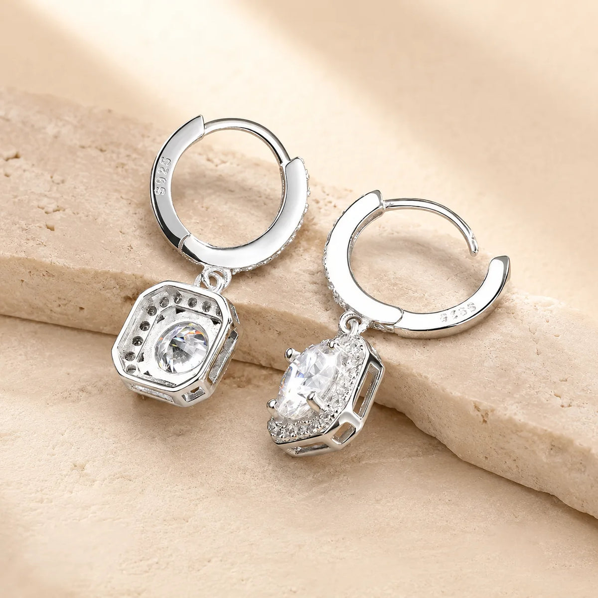 Back and side view of Marielle™ halo moissanite drop earrings showing the secure huggie clasps and stone settings.