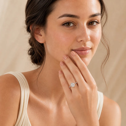 Woman showcasing an elegant oval-cut moissanite ring designed for engagements, anniversaries and special occasions.