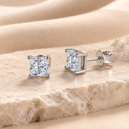 Front and side views of princess-cut moissanite stud earrings showing the square stones, raised settings and secure posts.