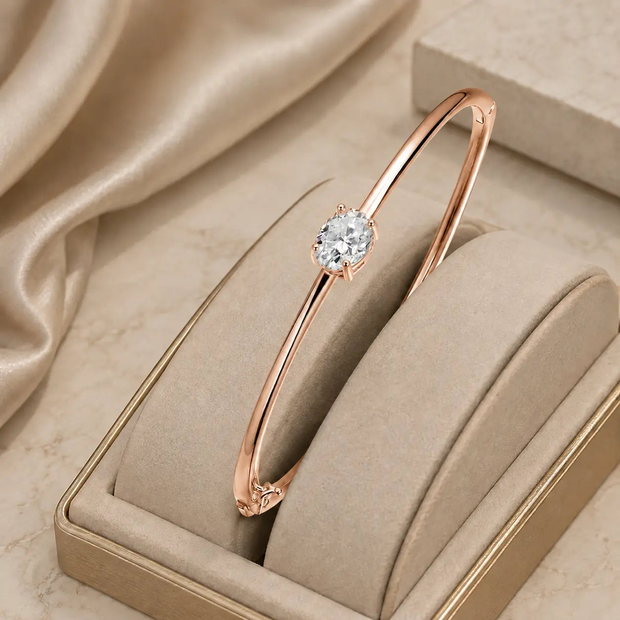 Rose gold-tone oval-cut moissanite bangle bracelet for women with a brilliant solitaire center stone.