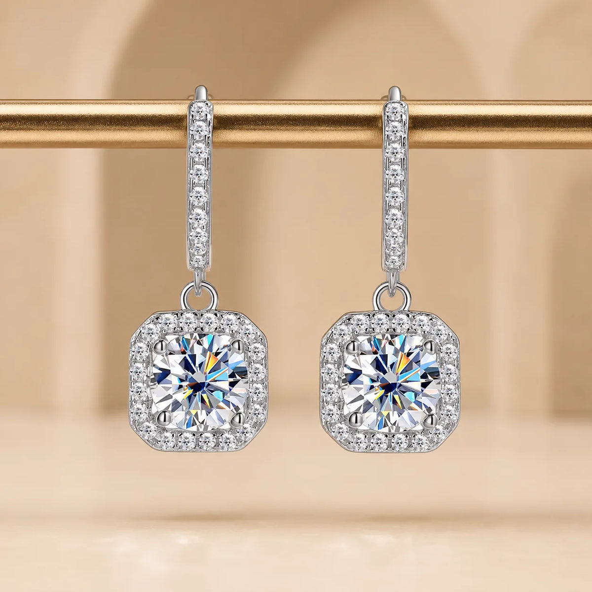Marielle™ silver moissanite drop earrings with brilliant round stones surrounded by sparkling cushion halos.