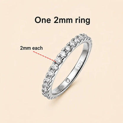 Sutton™ slim moissanite wedding band featuring a row of 2 mm round stones in a polished silver setting.