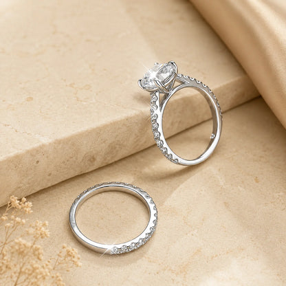 Side view of the Sutton™ Round Moissanite Bridal Set showing the raised solitaire setting and matching pavé wedding band.