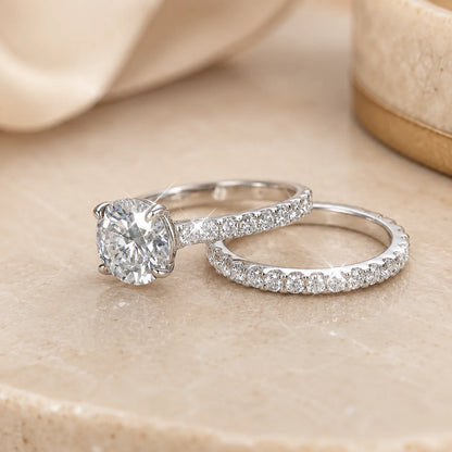 Sutton™ Round Moissanite Bridal Set displayed in polished silver with a brilliant center stone and matching pavé band.