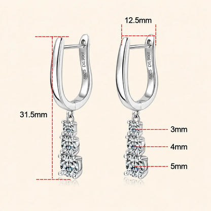 Size guide for sterling silver huggie drop earrings measuring 31.5 mm long with graduated 3 mm, 4 mm and 5 mm round stones.