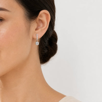 Woman wearing Valenne™ 2CT Moissanite Drop Stud Earrings for an elegant and refined look.