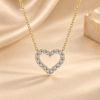 Gold tone heart moissanite pendant necklace with a delicate matching chain