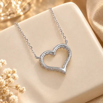 Back detail of an open heart moissanite pendant necklace showing the pendant setting