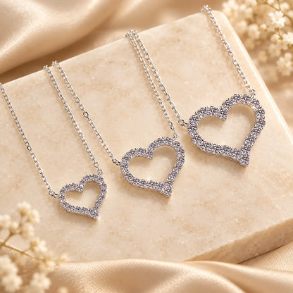Heart moissanite pendant necklaces shown side by side in multiple stone sizes