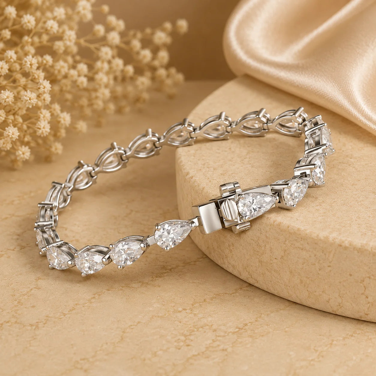 Close-up angled view of the Langley™ pear-cut moissanite tennis bracelet for women showing the stone settings and clasp detail.