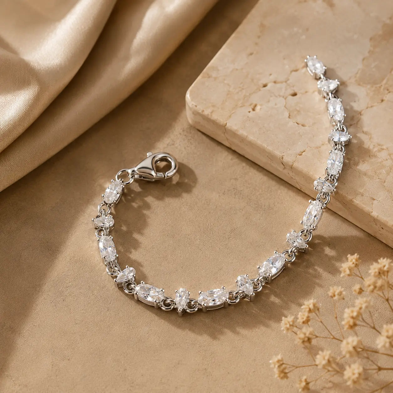 Mixed-cut moissanite tennis bracelet for women displayed open to show the stone arrangement and secure clasp.